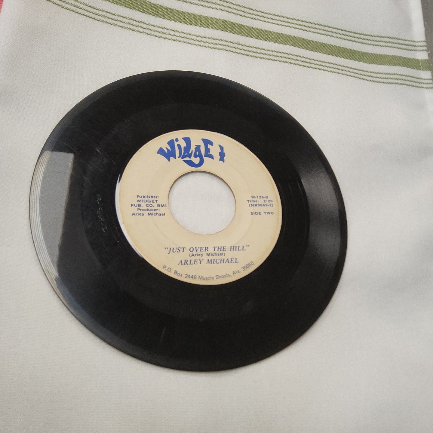 45 double sided record by Arley Michael "Just over the hill" and "When this old world breaks out of flames"