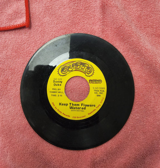 45 double sided record Featuring Don Wayne "Keep those flowers watered" and A.L Doodle Owens/ Dallas Frazier "The man you're most likely to forget"