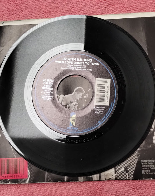 45 double sided record presenting U2 with BB King "When love comes to town" and " Dancing Barefoot"