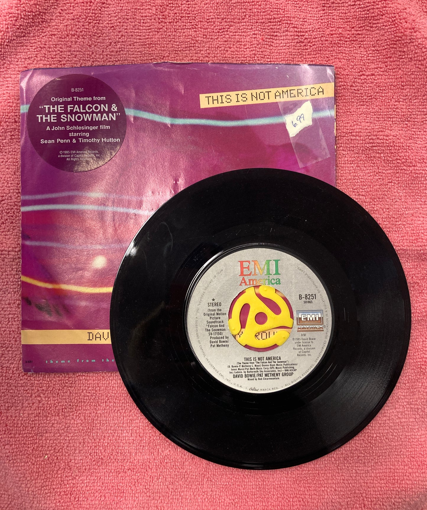 45 double sided soundtrack record for The Falcon and the Snowman "This is not America" featuring David Bowie and Pat Metheny Group and instrumental version