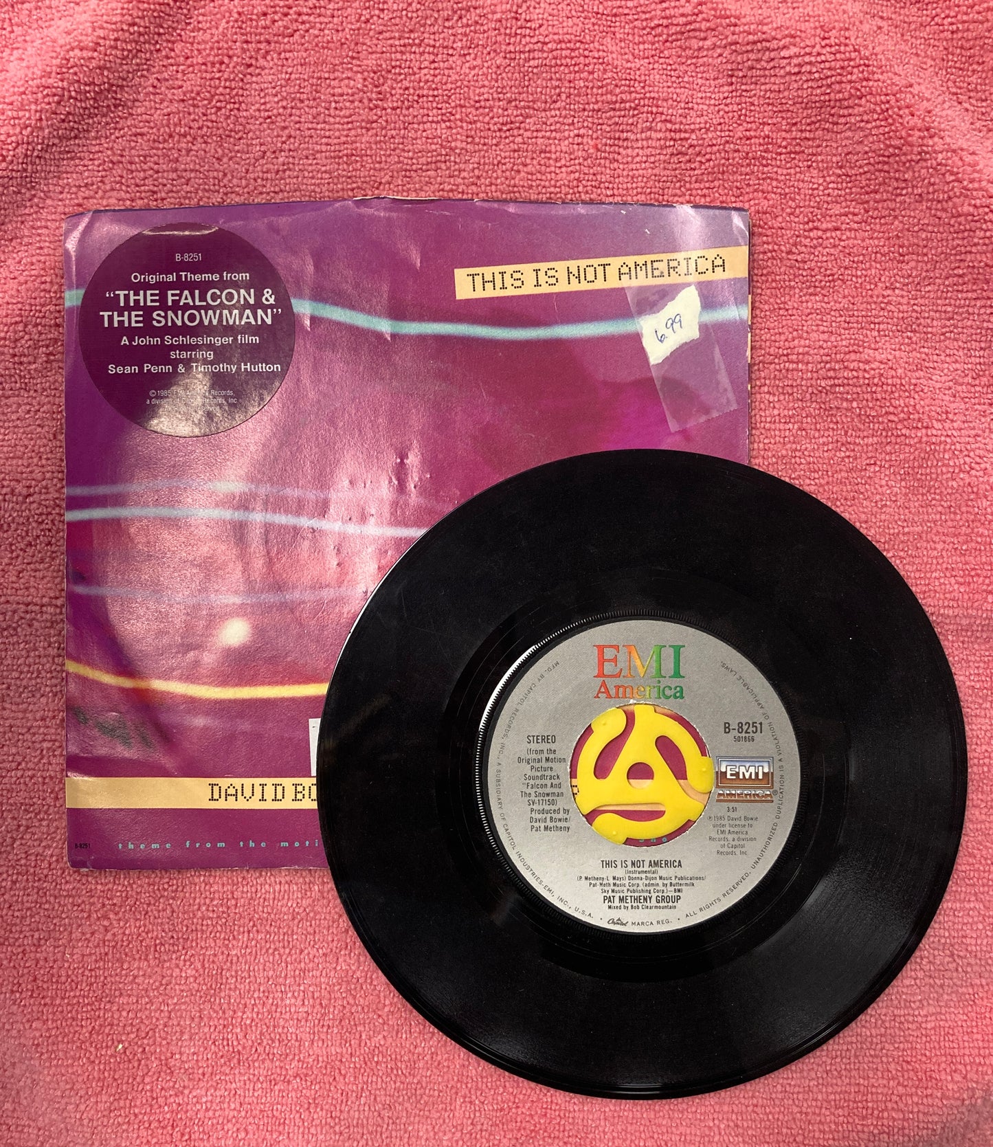 45 double sided soundtrack record for The Falcon and the Snowman "This is not America" featuring David Bowie and Pat Metheny Group and instrumental version