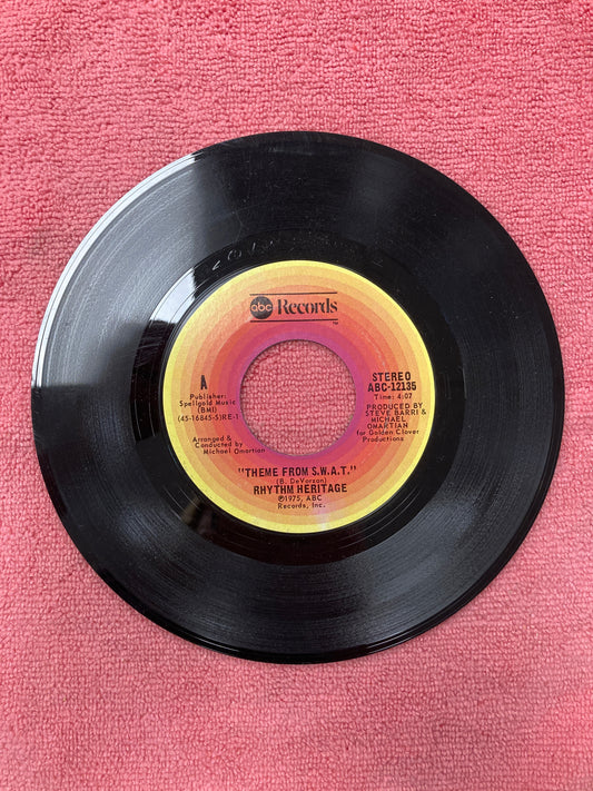 45 double sided record Rhythm Heritage "Theme from S.W.A.T" and "I wouldn't treat a dog"