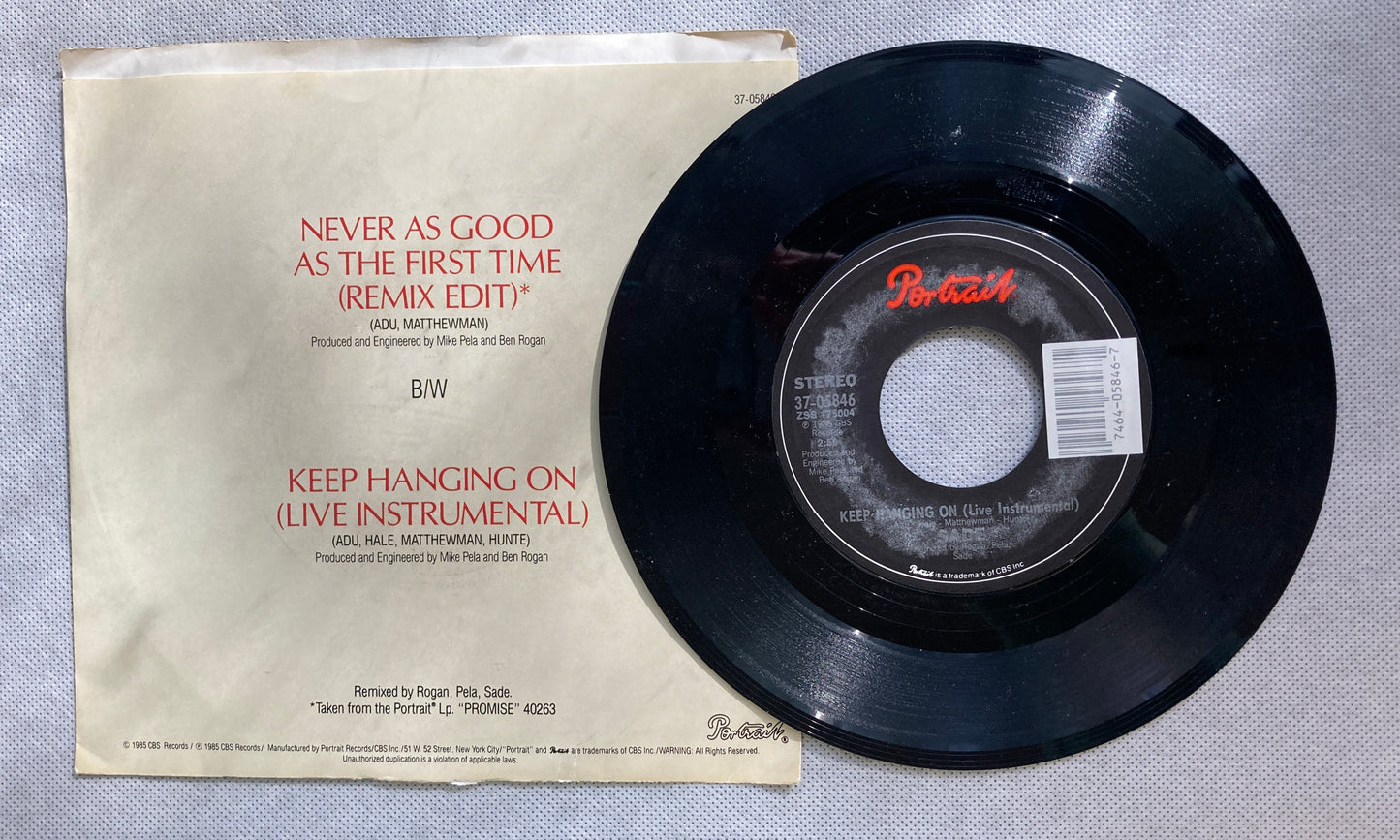 45 double sided SADE record "Never as good as the first time (remix) and "Keep hanging on (live instrumental)"