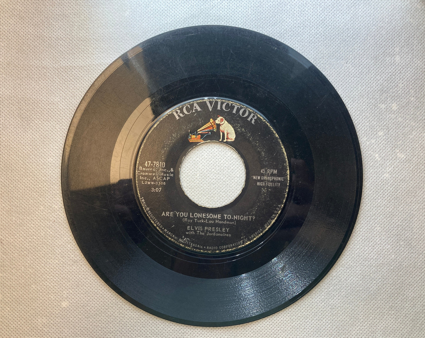 45 double sided Elvis Presley record "I gotta know" and "Are you lonesome tonight"