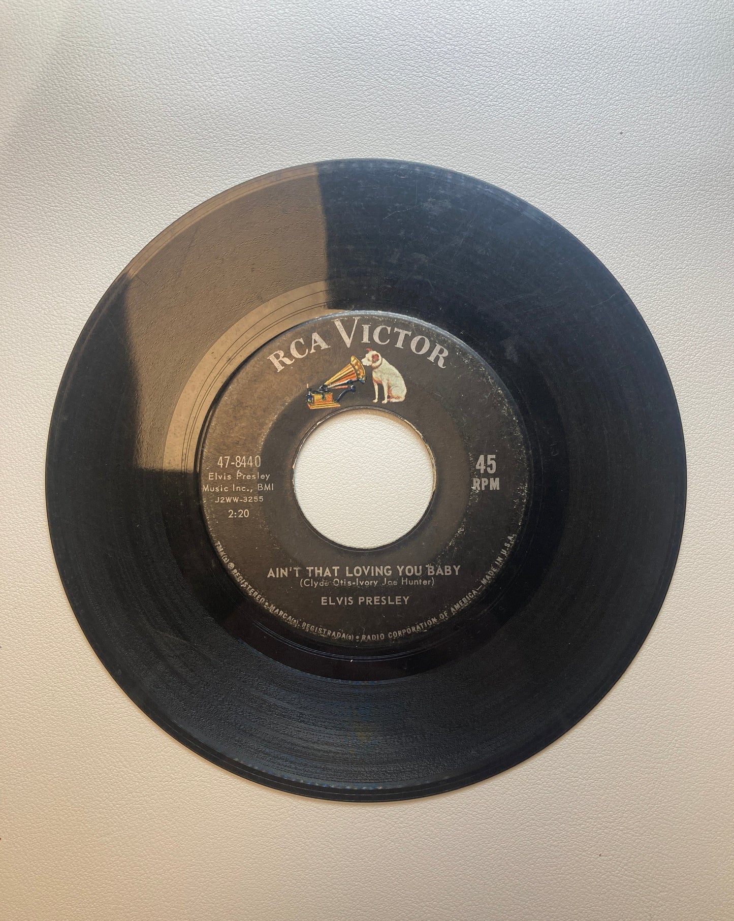 45 double sided Elvis Presley record "Ask me" and "Ain't that loving you baby"