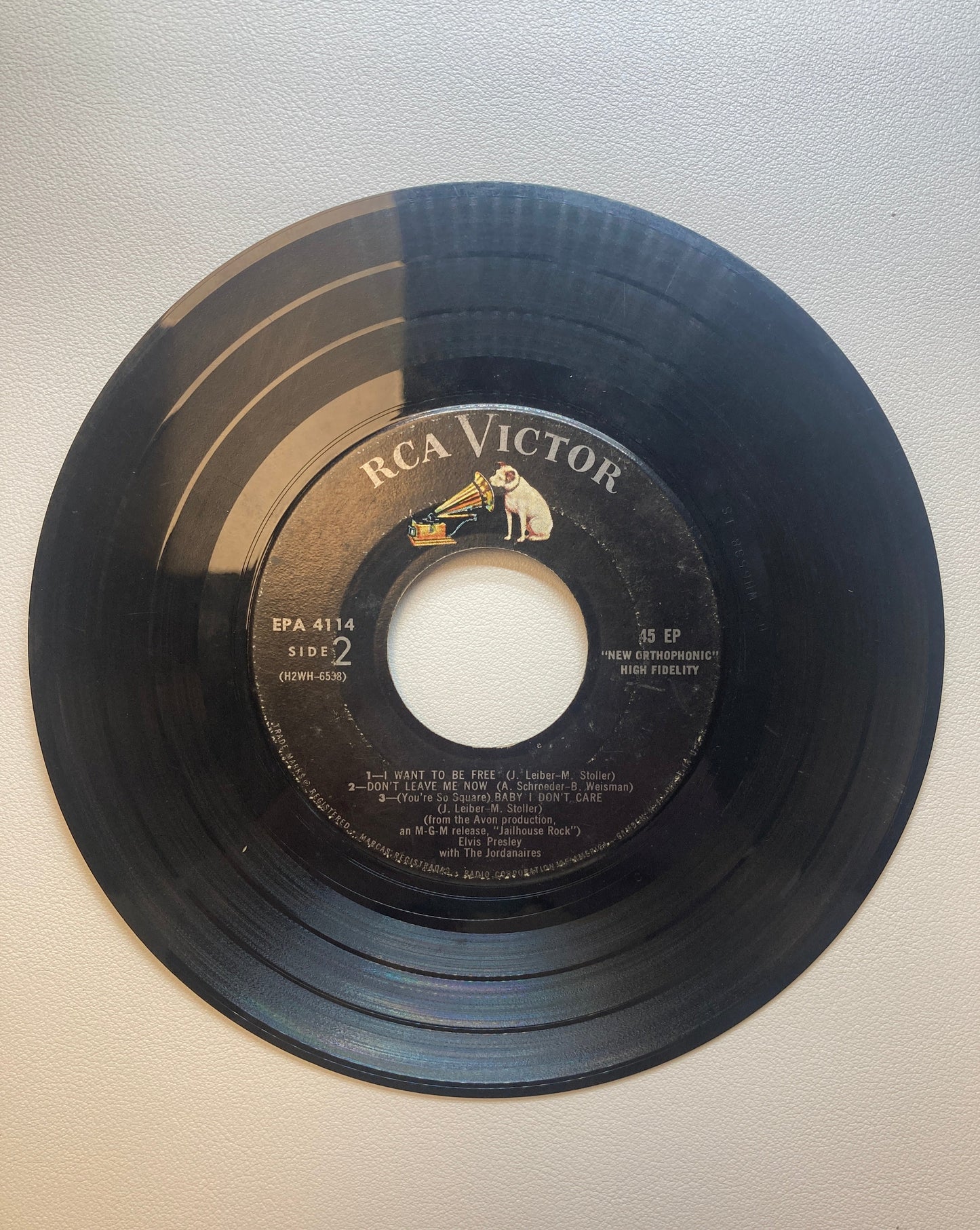 45 double sided Elvis Presley record "Jailhouse Rock", "Young and Beautiful", "I want to be free" , "Don't leave me now", and Baby I don't care"