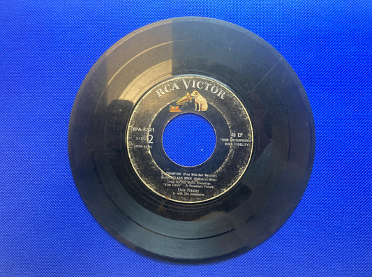 45 double sided Elvis Presley record featuring "Crawfish" , "Dixieland Rock", "Trouble" and "Young Dreams"