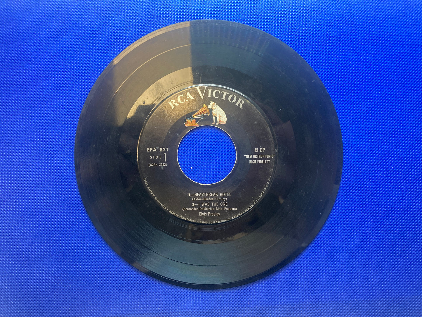 45 double sided Elvis Presley record featuring "Heartbreak Hotel" , "I Was the One", "Money Honey" and "I Forgot To Remember To Forget"