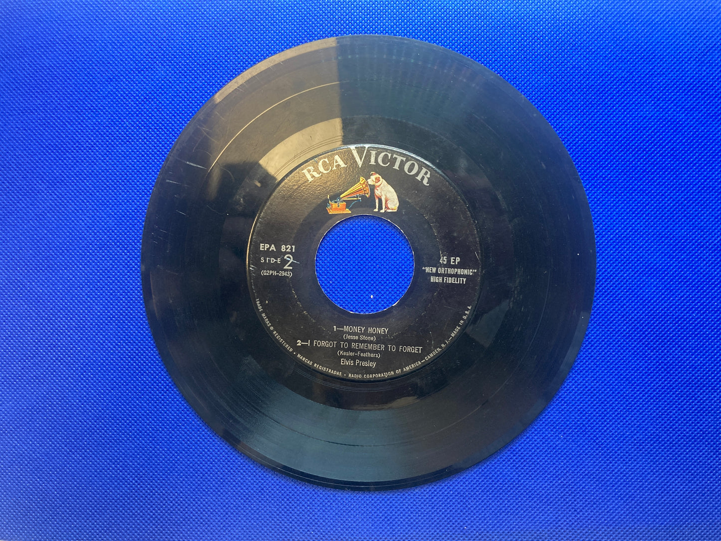 45 double sided Elvis Presley record featuring "Heartbreak Hotel" , "I Was the One", "Money Honey" and "I Forgot To Remember To Forget"