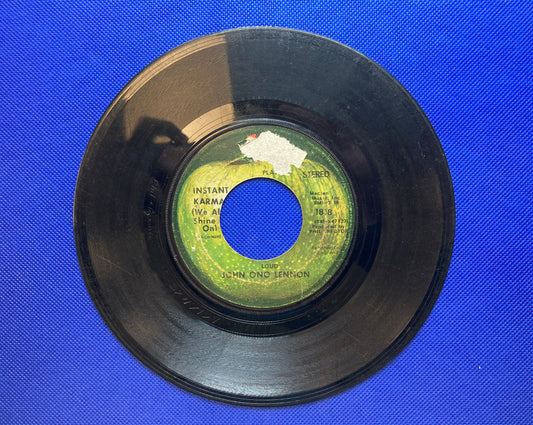 45 double sided John Ono Lennon and Yoko Ono Lennon featuring "Instant Karma" and "Who Has Seen The Wind?"