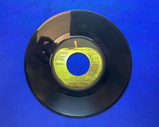 45 double sided George Harrison record "Give me love" and "Miss O'Dell"