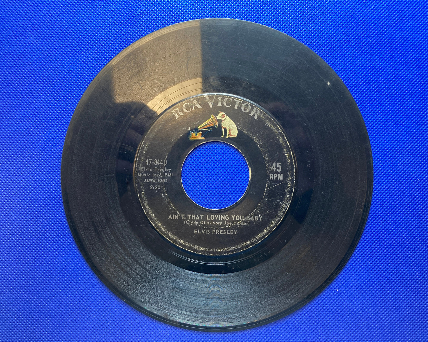 45 double sided Elvis Presley record "Ask Me" and "Ain't That Loving You Baby"