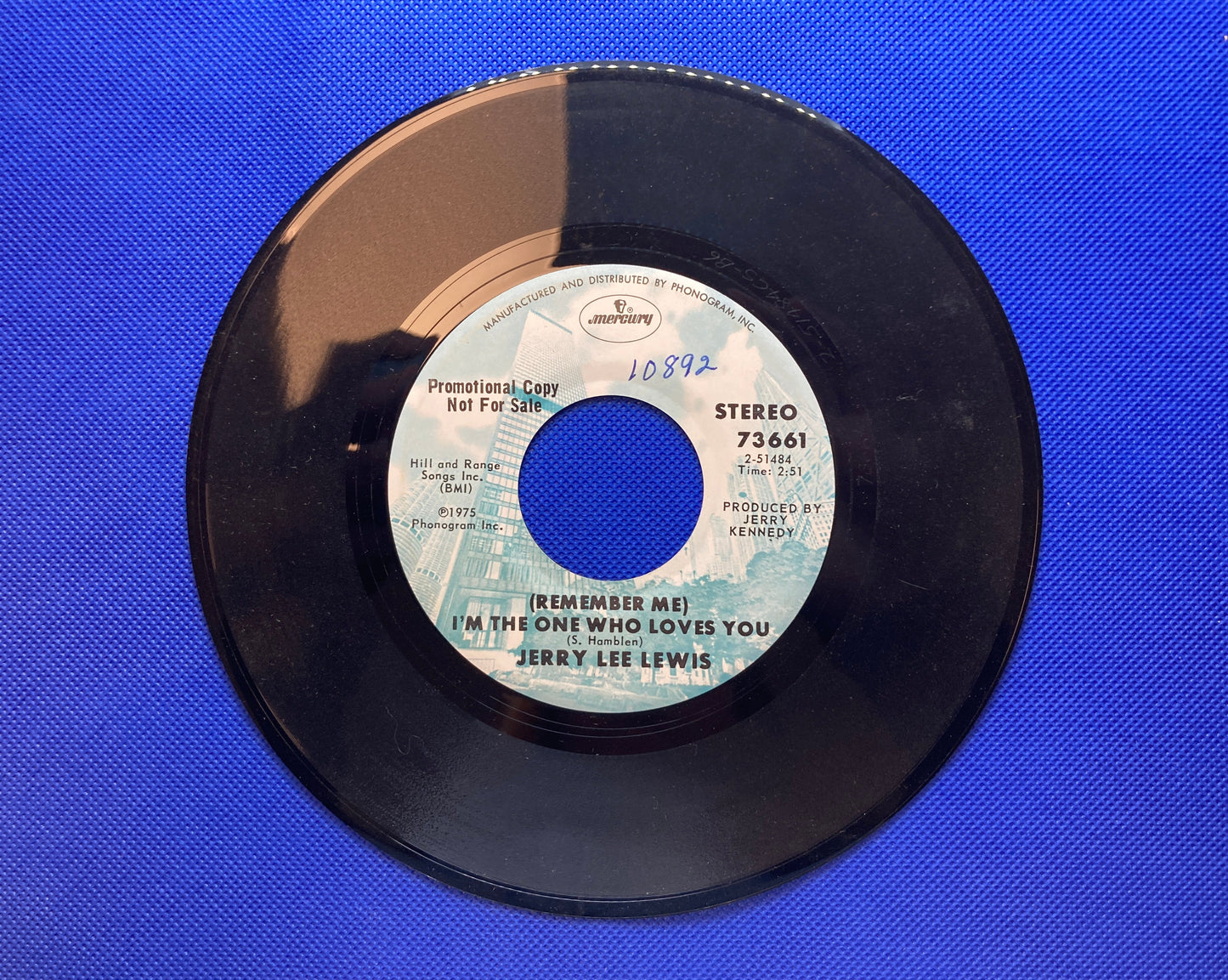 45 double sided Jerry Lee Lewis record "(Remember me) I'm the one who loves you" and "I can still hear the music in the restroom"