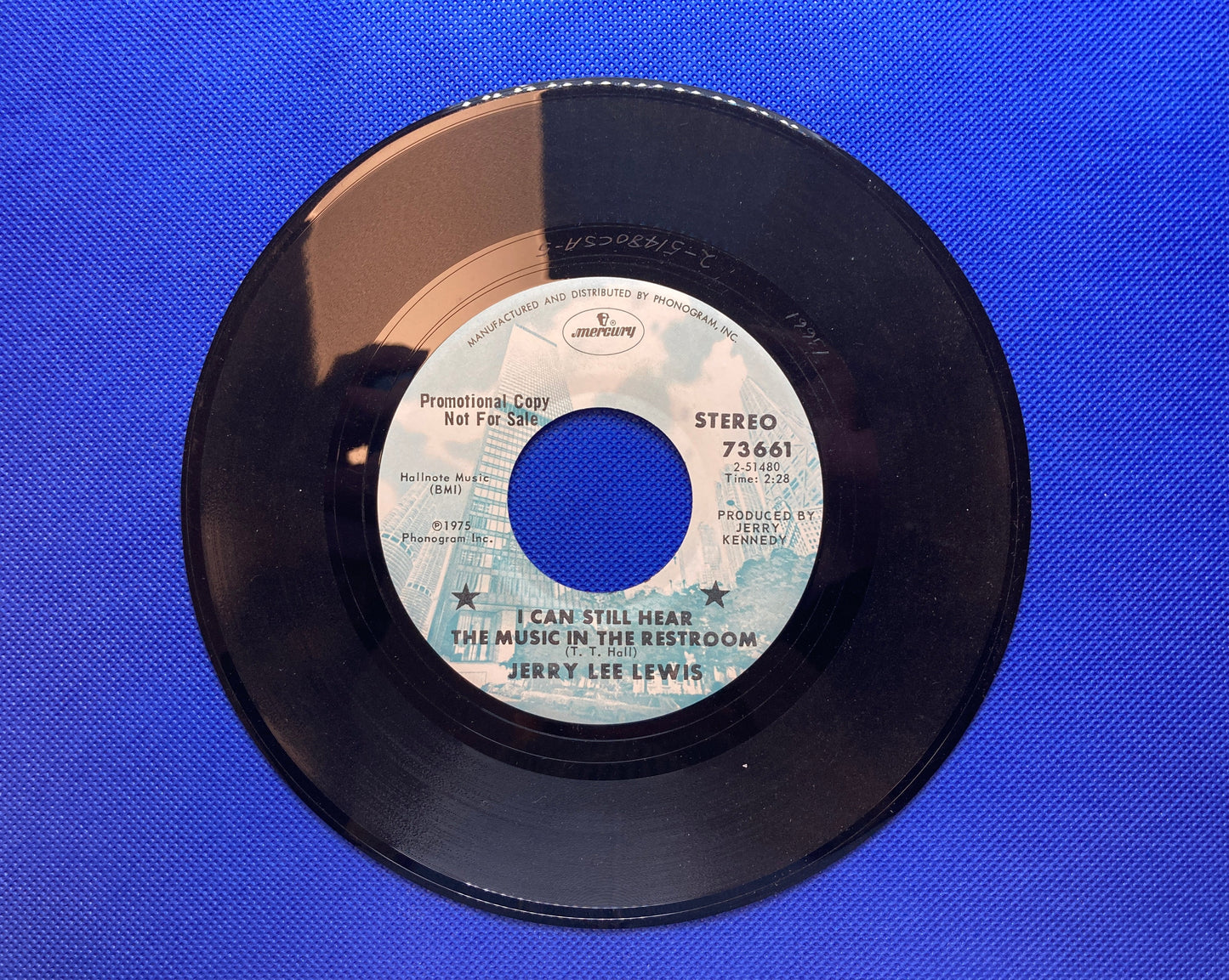 45 double sided Jerry Lee Lewis record "(Remember me) I'm the one who loves you" and "I can still hear the music in the restroom"