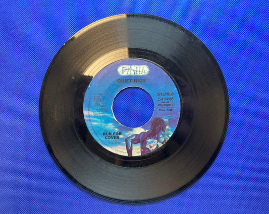 45 double sided Quiet Riot record "Run for cover" and "Cum on feel the noise"