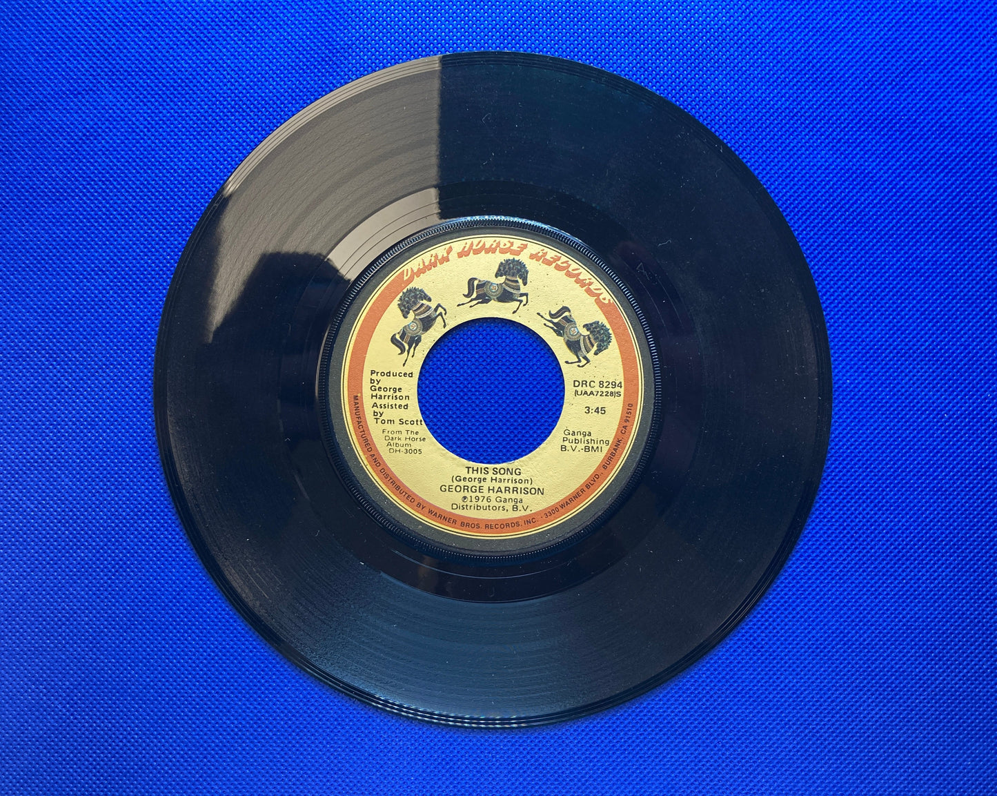 45 double sided George Harrison record "Learning how to love you" and "This song"