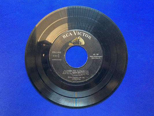 45 double sided Elvis Presley record "Loving You" , "Party" , "Teddy Bear" and "True Love"