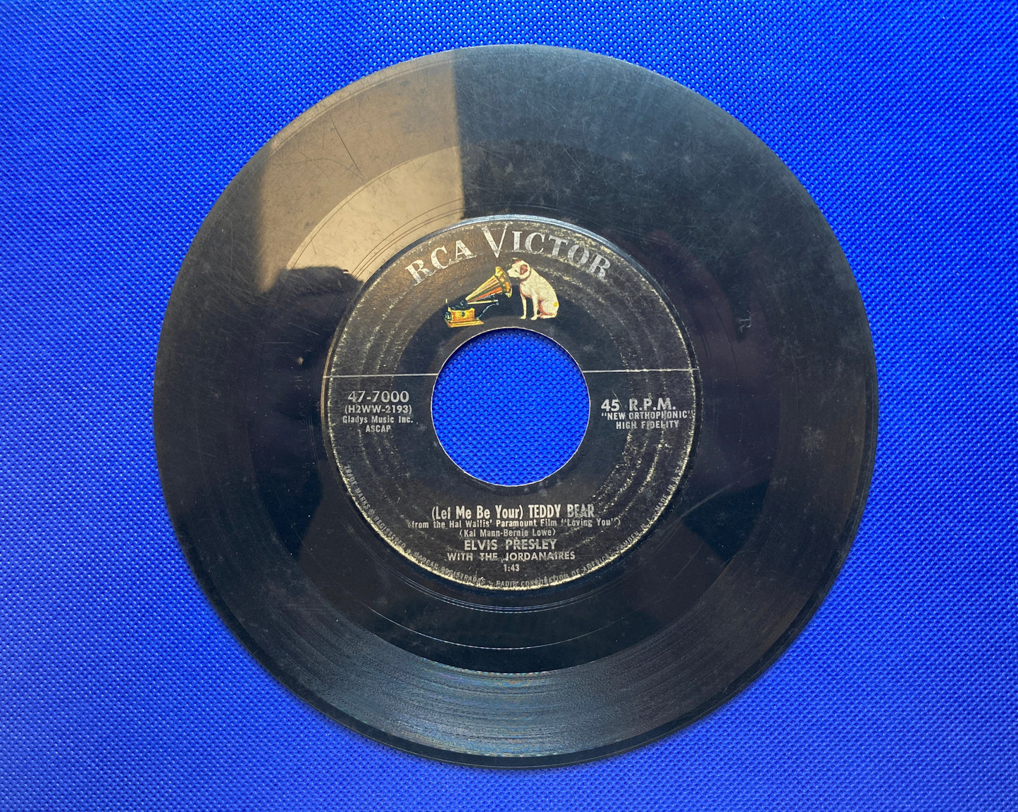 45 double sided Elvis Presley record "(Let me be your teddy bear" and "Loving you"