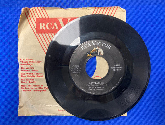 45 double sided Elvis Presley record with plain sleeve "I gotta know" and "Are you lonesome tonight"