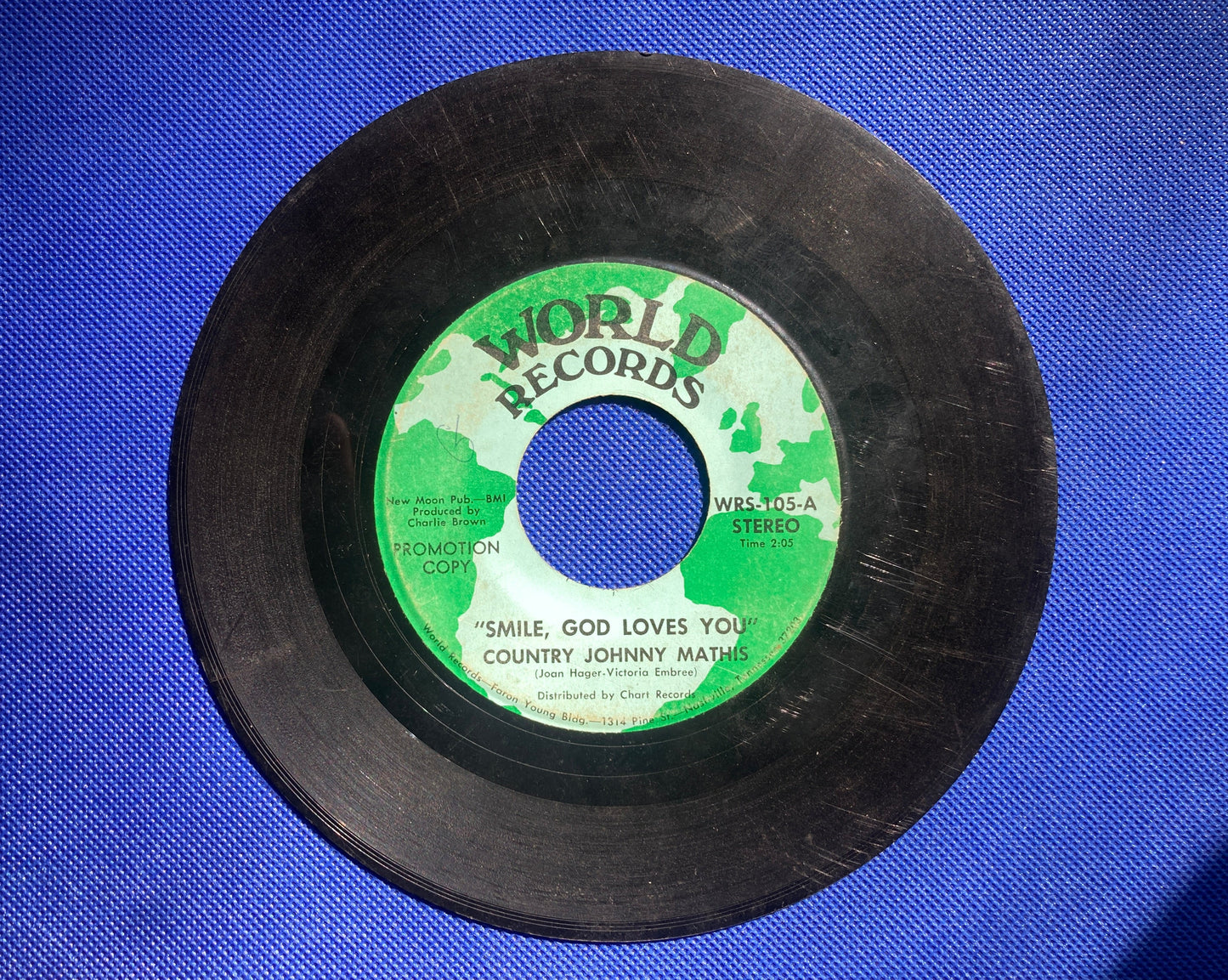 45 double sided Country Johnny Mathis record "Hurting losers song" and "Smile, god loves you"