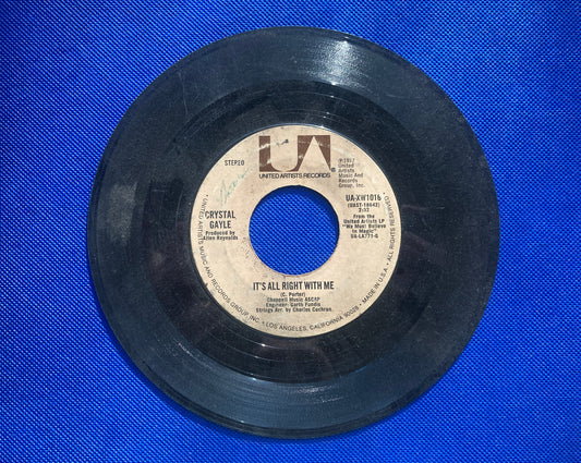 45 double sided Crystal Gayle record "It's all right with me" and "Don't it make my brown eyes blue"